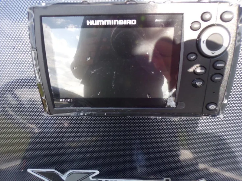 Slide: The Image of Humminbird Helix 5 fish finder on 2025 Xpress H20BAY boat dashboard. - 11