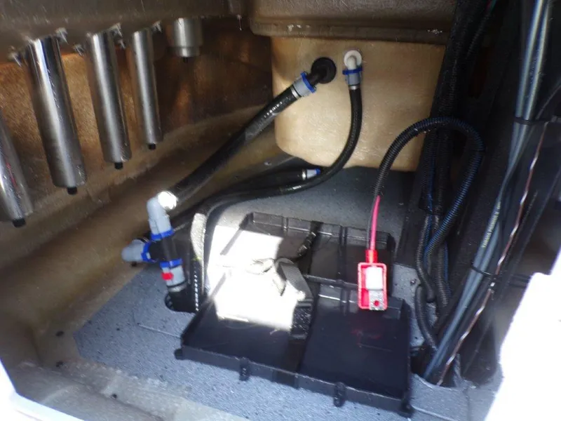 Slide: The Image of 2025 Xpress H20BAY boat interior wiring and components, showcasing organized cables and connectors. - 12