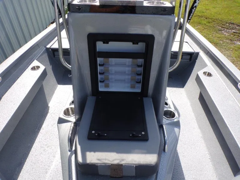 Slide: The Image of 2025 Xpress H20BAY boat console with storage compartment and cup holders. - 13