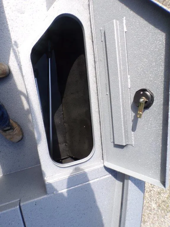 Slide: The Image of 2025 Xpress H20BAY boat storage compartment with open hatch and visible interior. - 16