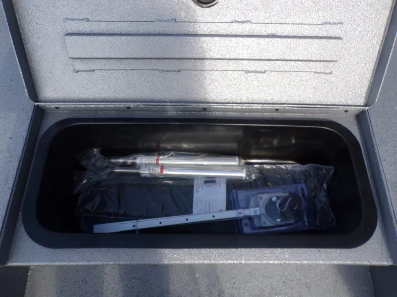 Slide: The Image of Storage compartment of 2025 Xpress H20BAY boat with equipment inside. - 19
