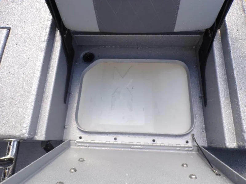 Slide: The Image of 2025 Xpress H20BAY boat interior storage compartment, gray and white design. - 21