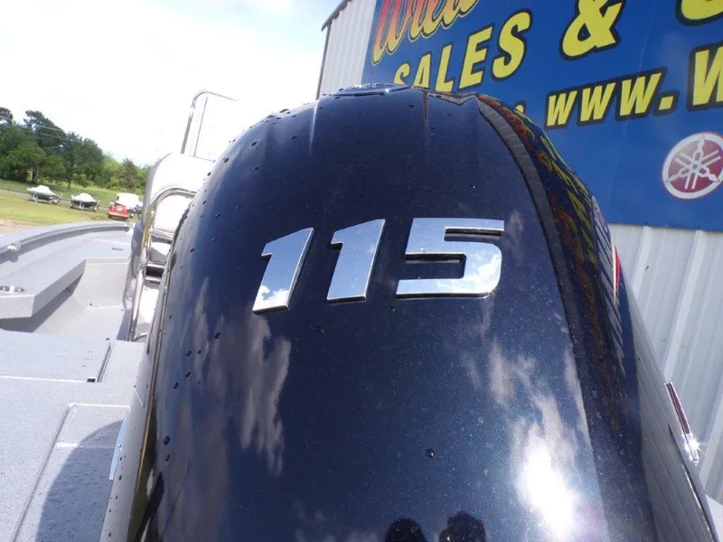 Slide: The Image of 2025 Xpress H20BAY boat with 115 horsepower engine, outdoor sales display. - 5