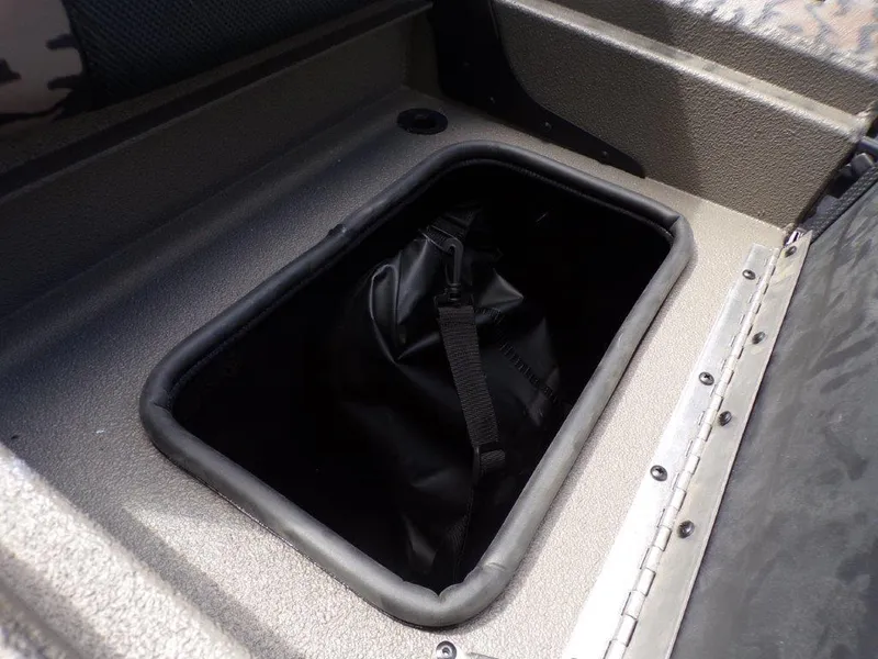 Slide: The Image of Storage compartment in 2025 Xpress XP20CC boat with black bag inside. - 11