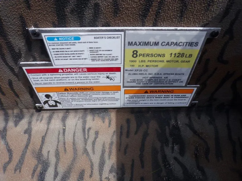 Slide: The Image of Boat capacity and safety warning labels on 2025 Xpress XP20CC, maximum 8 persons, 1128 lbs. - 3