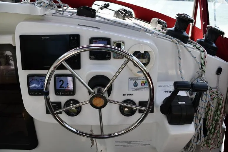 Slide: The Image of Steering console of 2014 Fountaine Pajot Mahe 36 Evolution catamaran with navigation instruments. - 12