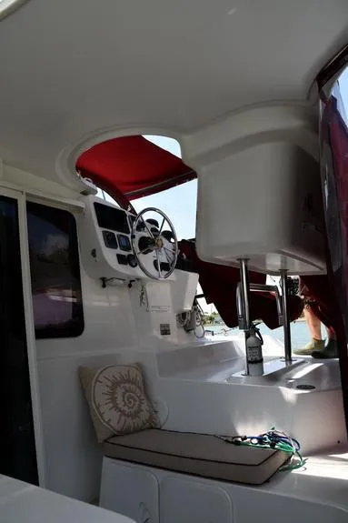Slide: The Image of 2014 Fountaine Pajot Mahe 36 Evolution yacht interior with helm and seating area. - 16