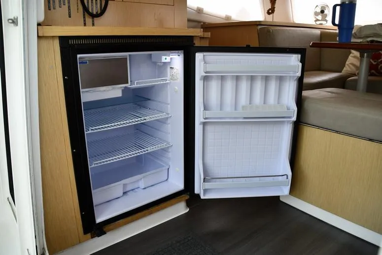 Slide: The Image of Open fridge inside 2014 Fountaine Pajot Mahe 36 Evolution catamaran, showcasing interior storage. - 43