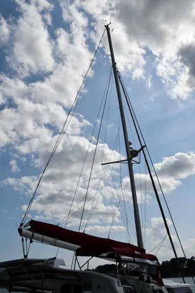 Slide: The Image of Sailboat mast of 2014 Fountaine Pajot Mahe 36 Evolution against cloudy sky. - 5