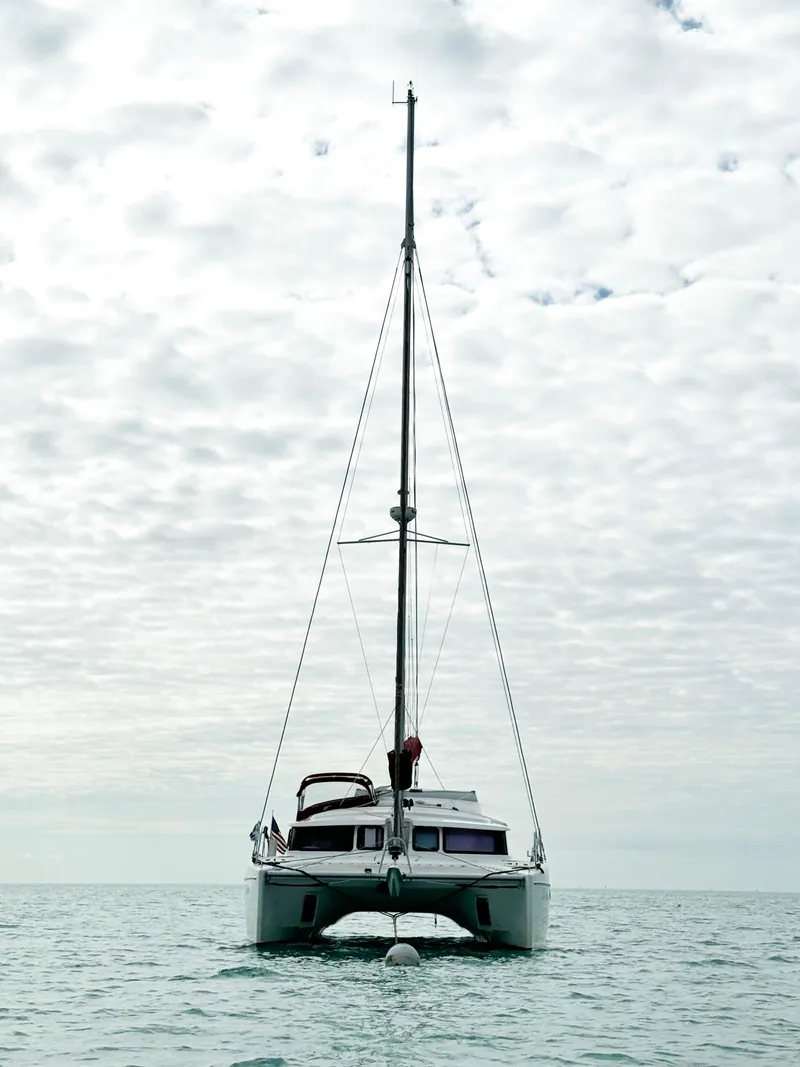 Slide: The Image of 2014 Fountaine Pajot Mahe 36 Evolution catamaran on calm sea under cloudy sky. - 9
