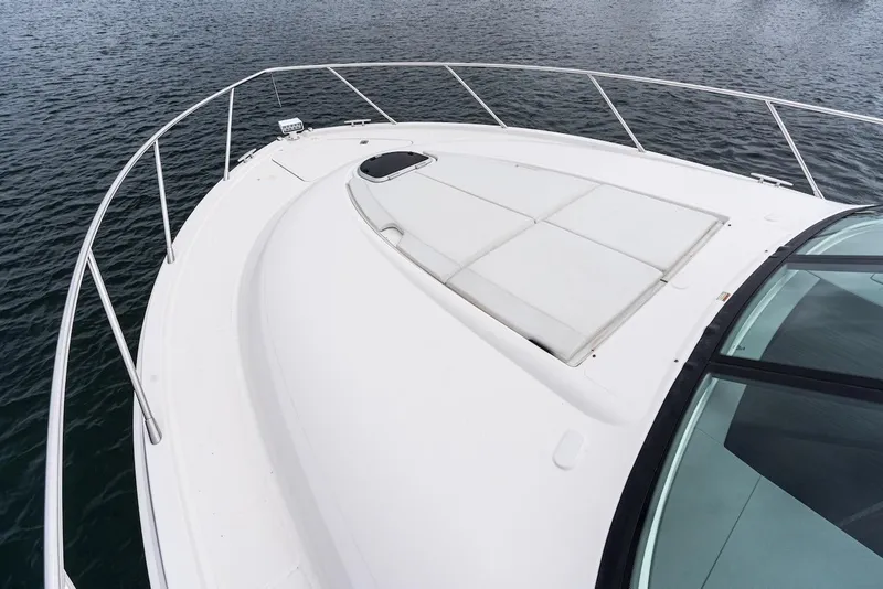 Slide: The Image of 2019 Tiara Yachts F 53 bow view with sleek design on water. - 11