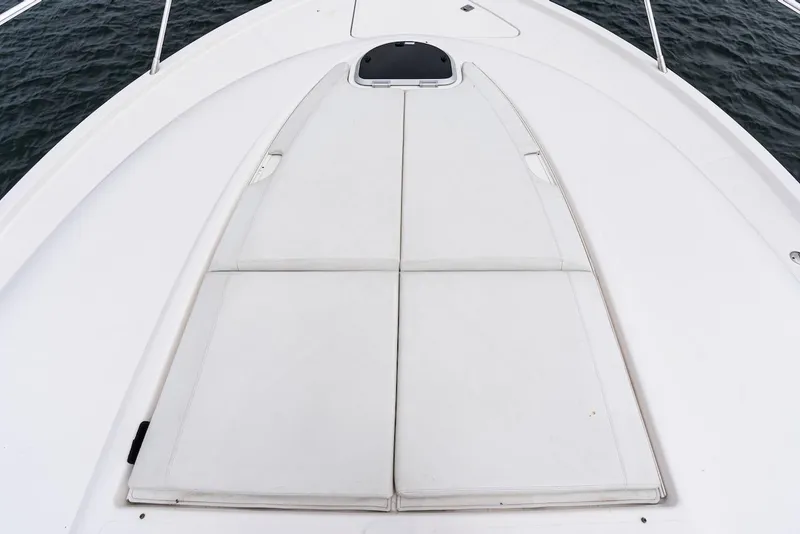 Slide: The Image of 2019 Tiara Yachts F 53 deck with cushioned sunpad, ocean view. - 12