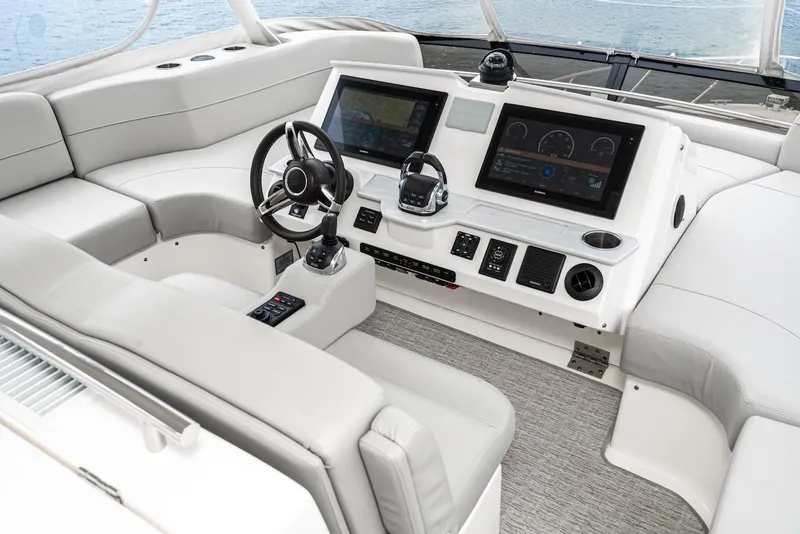 Slide: The Image of Luxurious helm of 2019 Tiara Yachts F 53 with modern navigation displays. - 18