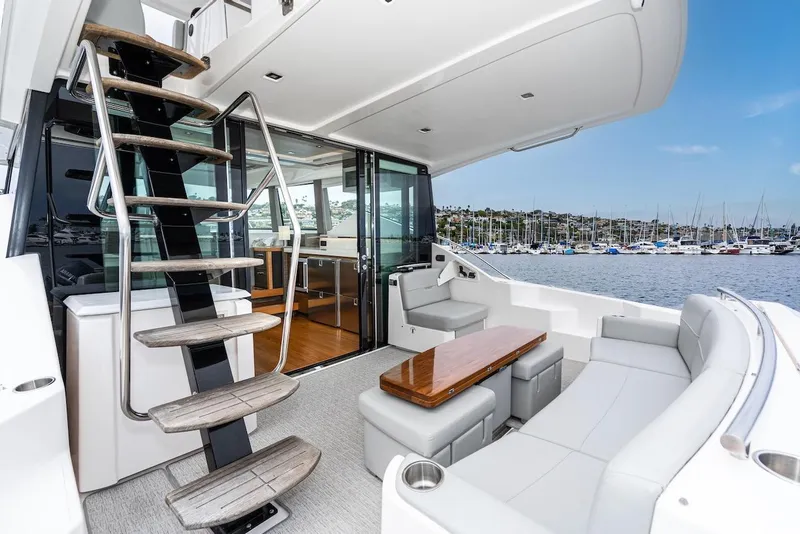Slide: The Image of Luxurious 2019 Tiara Yachts F 53 interior with seating and marina view. - 33