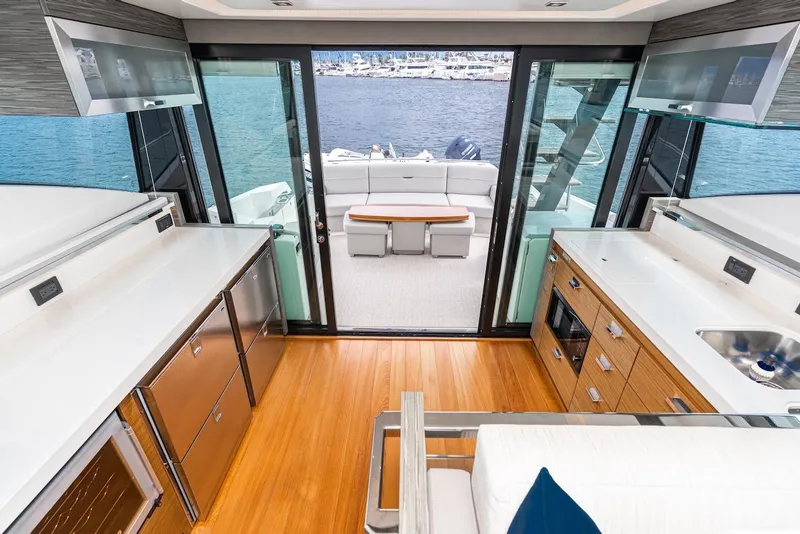 Slide: The Image of Luxurious interior of 2019 Tiara Yachts F 53 with modern kitchen and scenic view. - 37