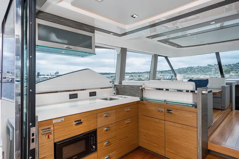 Slide: The Image of Luxurious interior of 2019 Tiara Yachts F 53, featuring modern kitchen and seating area. - 39