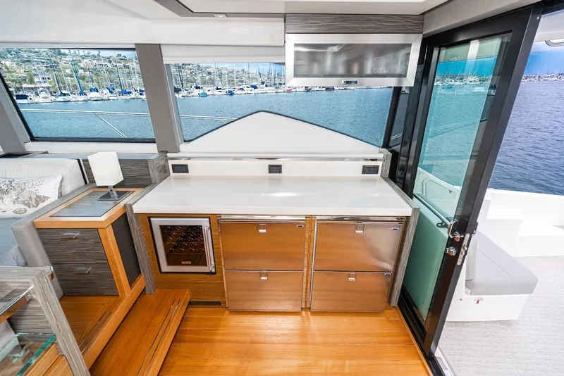 Slide: The Image of Luxurious interior of 2019 Tiara Yachts F 53 with modern kitchen and scenic marina view. - 43