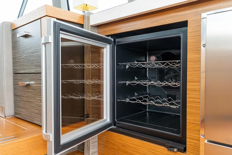 Slide: The Image of Open wine cooler on 2019 Tiara Yachts F 53, showcasing sleek interior design. - 44