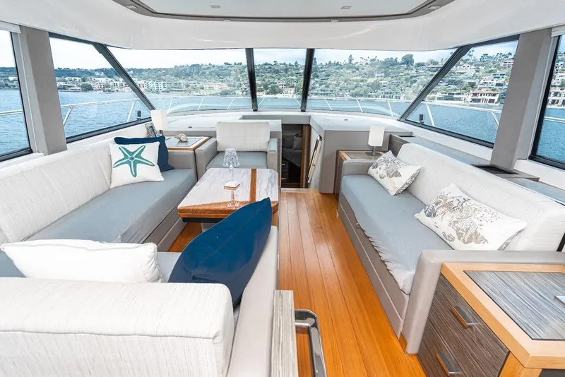 Slide: The Image of Luxurious interior of 2019 Tiara Yachts F 53 with elegant seating and panoramic windows. - 45
