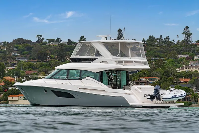 Slide: The Image of 2019 Tiara Yachts F 53 luxury yacht on calm water, scenic background. - 7