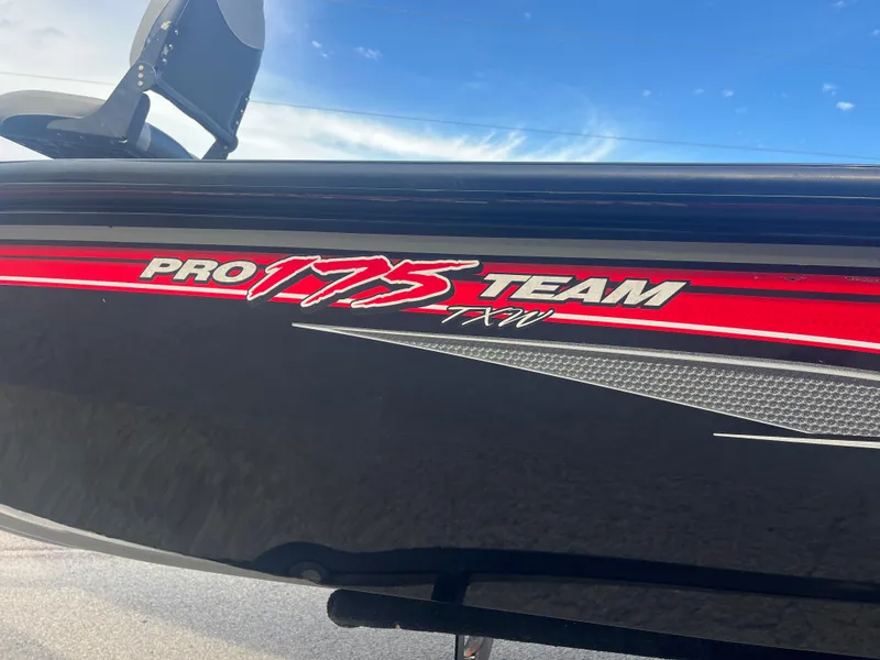 Slide: The Image of 2016 Tracker Pro Team 175 boat with red and white graphics. - 12
