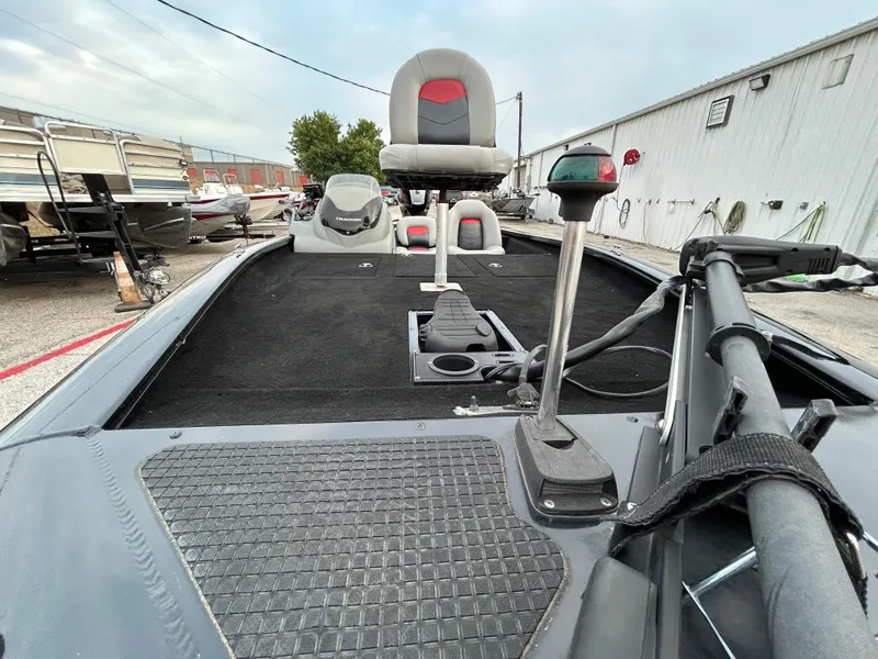 Slide: The Image of 2016 Tracker Pro Team 175 TXW boat interior with seating and equipment. - 18