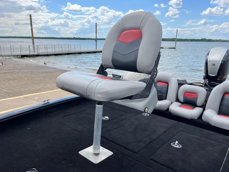 Slide: The Image of 2016 Tracker Pro Team 175 TXW boat seat on deck by the lake. - 19