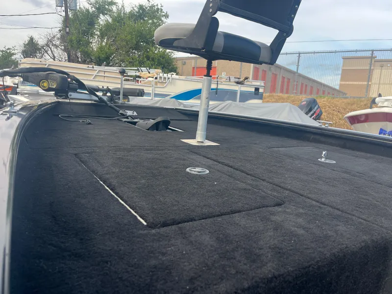 Slide: The Image of 2016 Tracker Pro Team 175 boat deck with seat and storage compartments. - 22