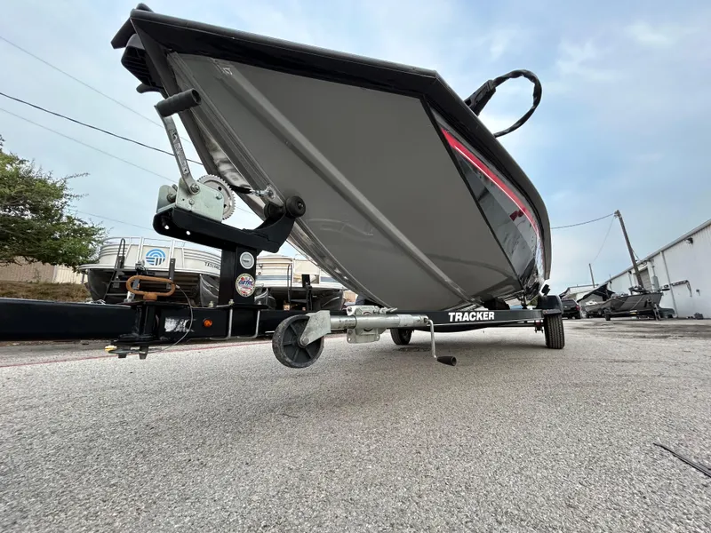 Slide: The Image of 2016 Tracker Pro Team 175 TXW boat on trailer, parked outdoors. - 29