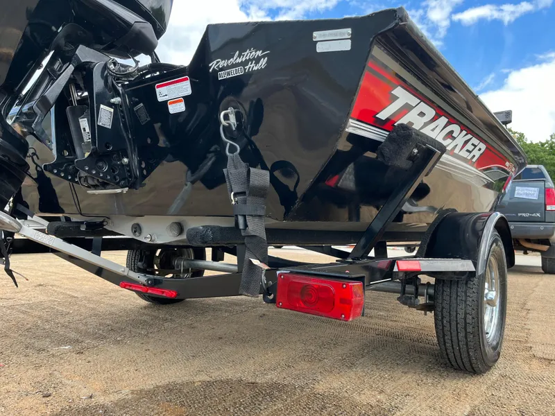 Slide: The Image of 2016 Tracker Pro Team 175 TXW boat on trailer, rear view, showcasing Revolution hull design. - 30