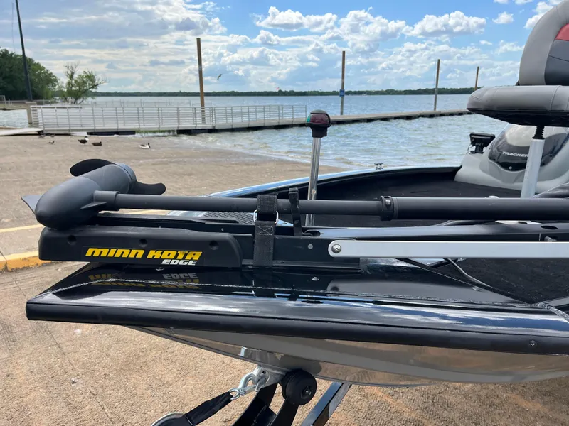 Slide: The Image of 2016 Tracker Pro Team 175 TXW with Minn Kota Edge trolling motor by a lake. - 31