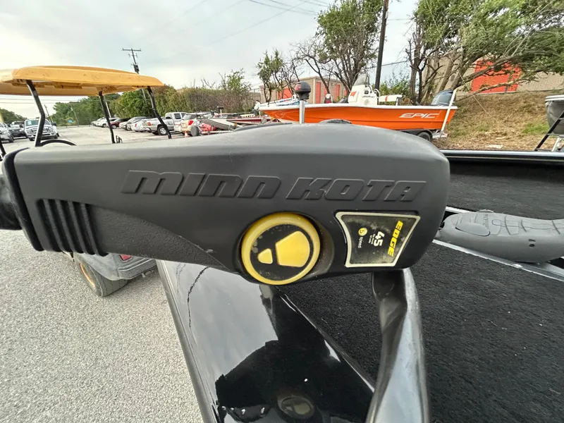 Slide: The Image of Minn Kota trolling motor on 2016 Tracker Pro Team 175 TXW boat, parked outdoors. - 34