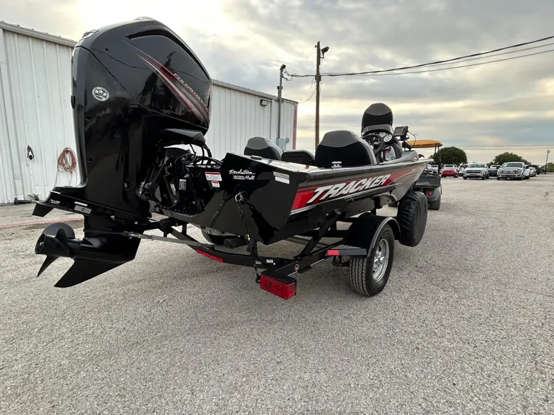 Slide: The Image of 2016 Tracker Pro Team 175 TXW boat on trailer, parked outdoors. - 4
