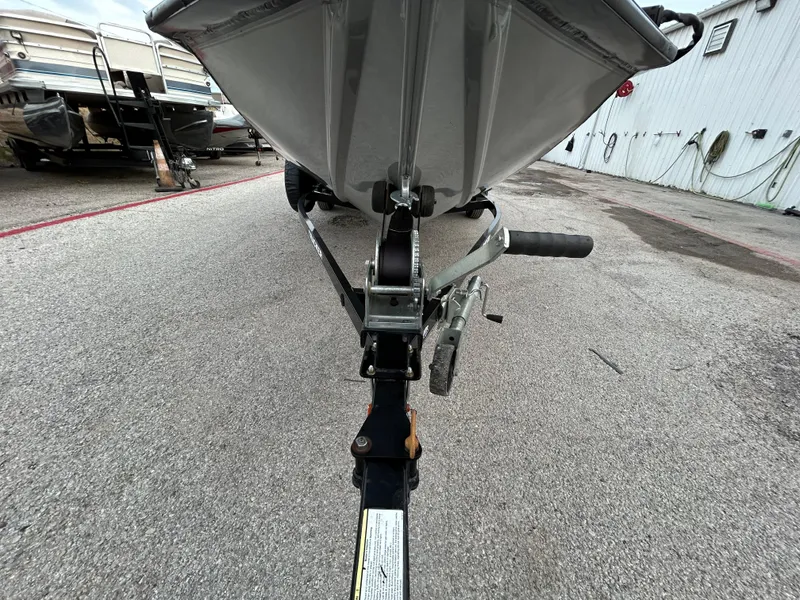 Slide: The Image of 2016 Tracker Pro Team 175 TXW boat trailer, front view, parked on concrete. - 41