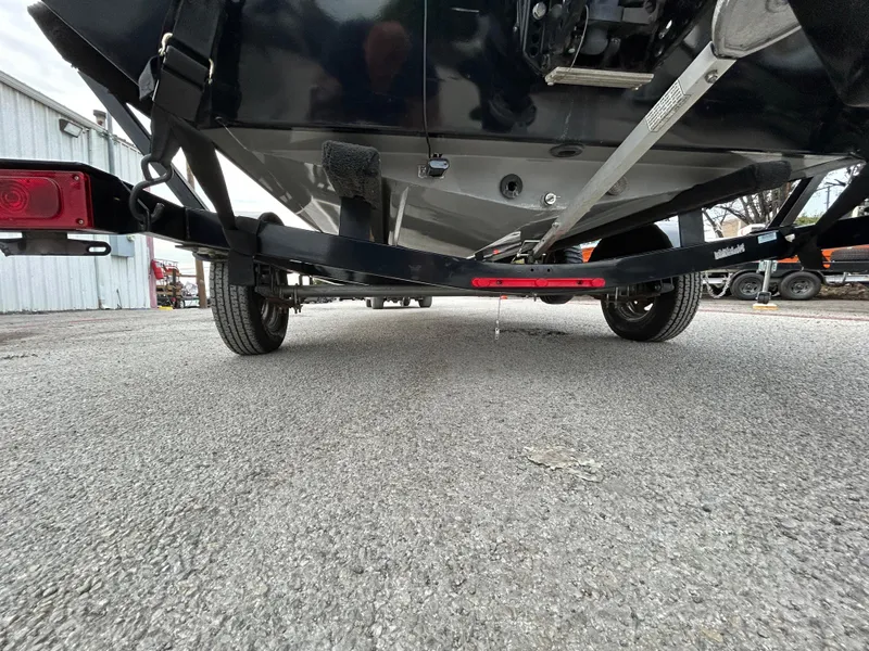 Slide: The Image of 2016 Tracker Pro Team 175 TXW boat trailer, viewed from the rear, parked on concrete. - 42