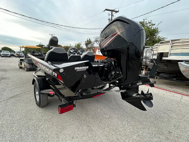 Slide: The Image of 2016 Tracker Pro Team 175 TXW boat with outboard motor on trailer. - 8