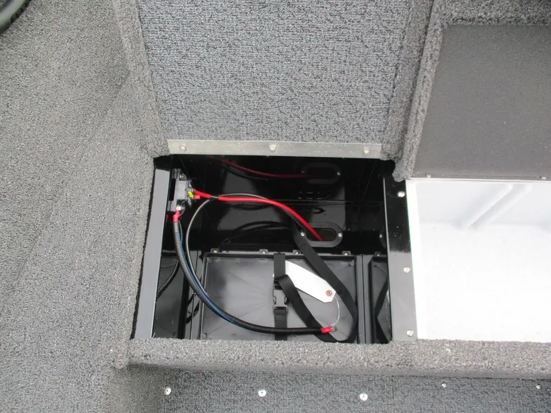 Slide: The Image of Battery compartment of 2025 Lund Rebel XL 1650 SS boat, showing wiring and connections. - 11