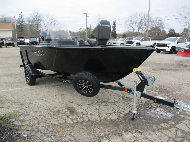Slide: The Image of 2025 Lund Rebel XL 1650 SS boat on trailer in parking lot. - 7