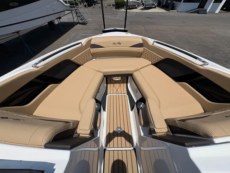 Slide: The Image of 2026 Sea Ray SLX 280 boat interior with tan seating and sleek design. - 10