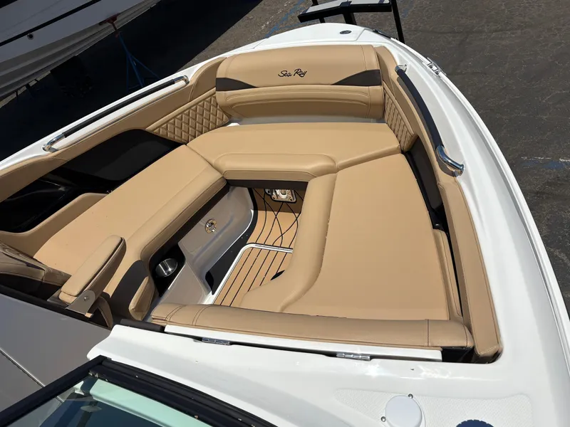 Slide: The Image of 2026 Sea Ray SLX 280 boat interior with tan seating and sleek design. - 3