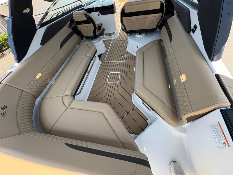 Slide: The Image of Luxurious interior of 2026 Sea Ray SLX 280 boat with tan seating and elegant flooring. - 5