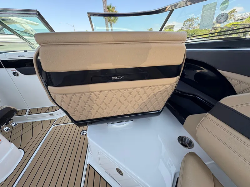 Slide: The Image of 2026 Sea Ray SLX 280 boat interior with tan leather seating and sleek design. - 6