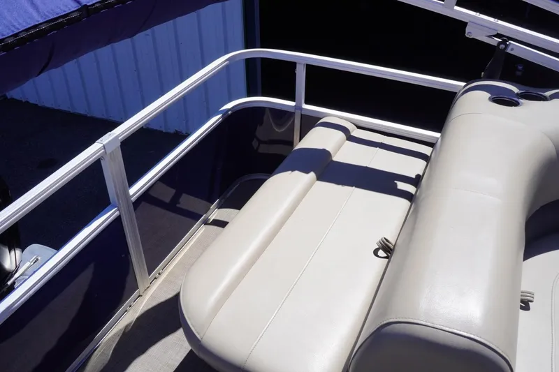 Slide: The Image of 2022 Sun Tracker Party Barge 18 DLX pontoon boat with beige seating and railing. - 20