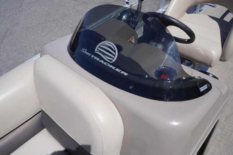 Slide: The Image of 2022 Sun Tracker Party Barge 18 DLX dashboard with steering wheel and seating. - 33