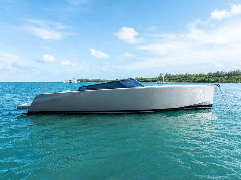 Slide: The Image of Luxury 2015 VanDutch 55 yacht on turquoise water under clear blue sky. - 1