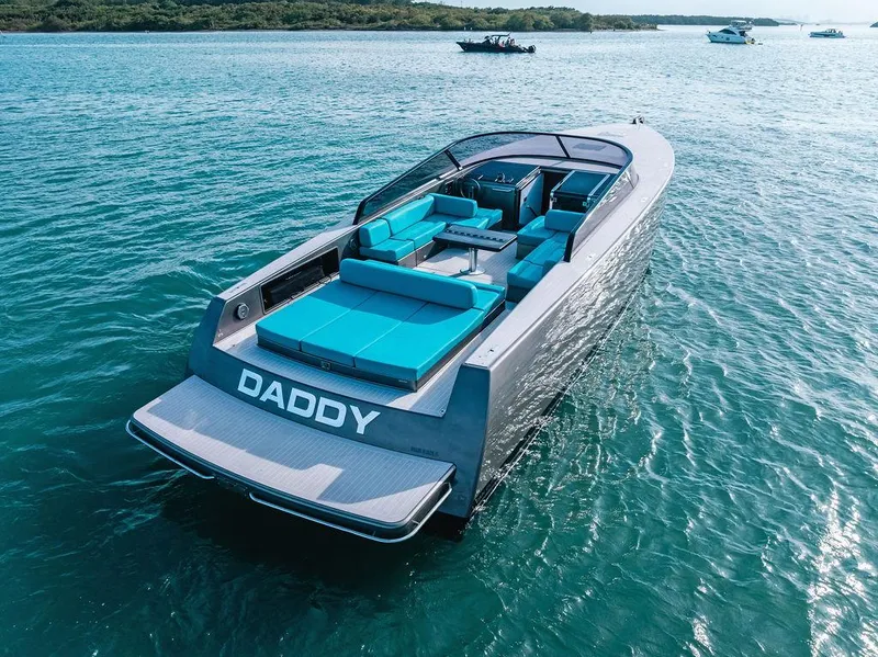 Slide: The Image of Luxury 2015 VanDutch 55 yacht with turquoise seating on open water. - 12