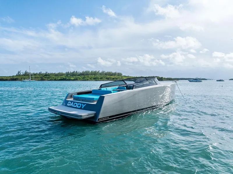 Slide: The Image of VanDutch 55 yacht from 2015 on clear blue water under a partly cloudy sky. - 13