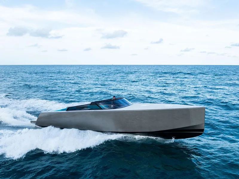 Slide: The Image of VanDutch 55 yacht cruising on open sea, 2015 model, sleek design, blue sky background. - 16