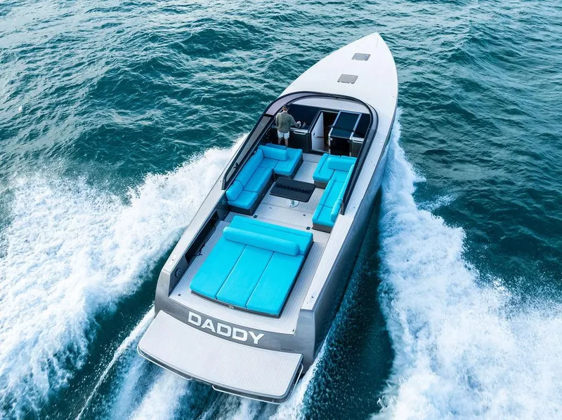 Slide: The Image of Luxurious 2015 VanDutch 55 yacht cruising on open water with sleek design and vibrant seating. - 20
