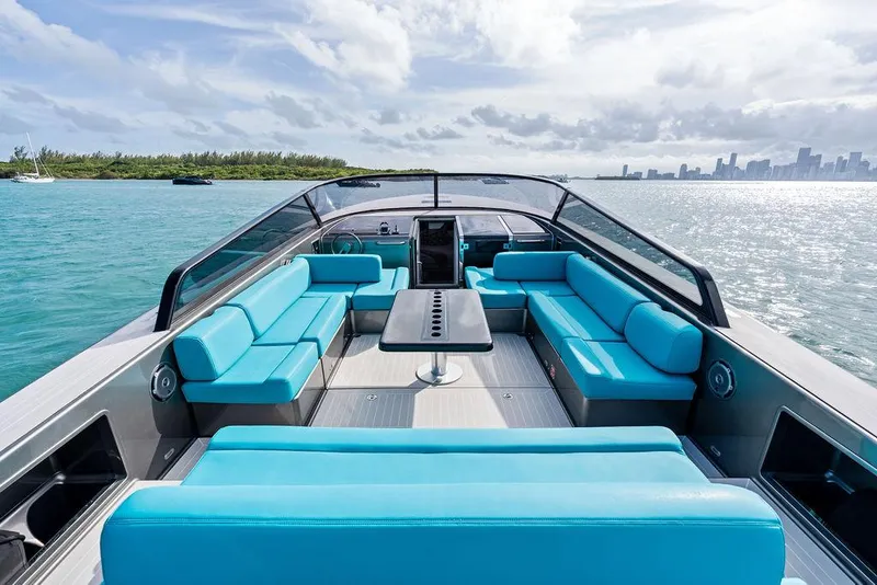 Slide: The Image of Luxurious 2015 VanDutch 55 yacht with turquoise seating, cruising on serene waters. - 24